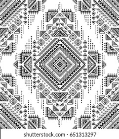 black and white tribal vector seamless pattern with doodle elements. aztec fancy abstract geometric art print. ethnic hipster background. hand drawn.  Wallpaper, cloth design, fabric, paper, textile.