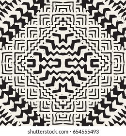 Black and white tribal vector seamless pattern with doodle elements. Aztec abstract geometric art print. Ethnic ornamental hand drawn backdrop.