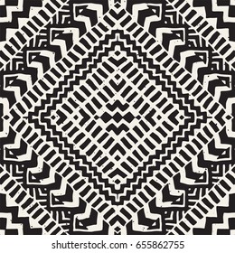 Black and white tribal vector seamless pattern with doodle elements. Aztec abstract geometric art print. Ethnic ornamental hand drawn backdrop.