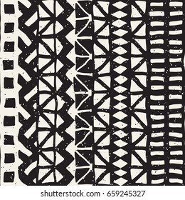 Black and white tribal vector seamless pattern with doodle elements. Aztec abstract geometric art print. Ethnic ornamental hand drawn backdrop.