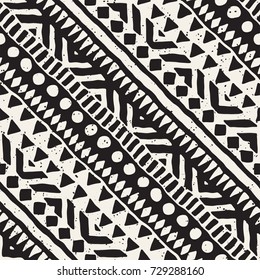 Black and white tribal vector seamless pattern with doodle elements. Aztec abstract art print. Ethnic ornamental hand drawn backdrop.