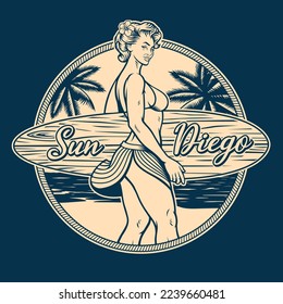 Black and white t-shirt badge with a pin up surfing girl on a beach