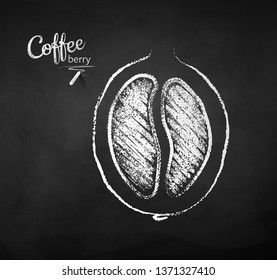 Black and white vector chalk drawn sketch of half cut coffee berry with bean on chalkboard background.