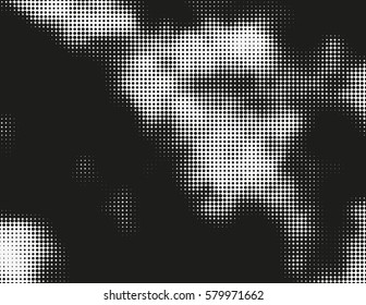 Black and white vector halftone background. Modern monochrome illustration. Chaotic abstract shapes. Grid of dots with different size. Graphic gradient made of round particles. Element of design.