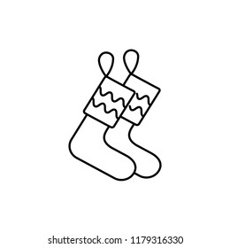 Black & white vector illustration of christmas stockings. Line icon of interior design product. Decorative festive socks for home. Isolated object on white background. 