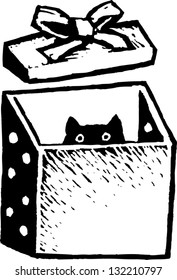 Black and white vector illustration of kitten in gift box