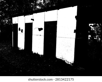 Black and white vector illustration of old outdoor toilet stalls or small cabins. High contrast architectural building silhouette for abstract grunge texture design element.