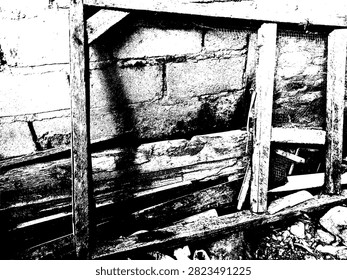 Black and white vector illustration of a rotted weathered wooden frame on ground against cinder block wall in high contrast linocut style EPS.