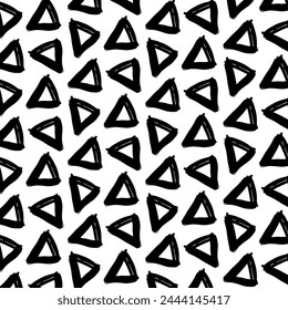 A black and white vector pattern with random, grungy, hand-drawn brushstroke triangles. Ideal for wrapping paper, banners, cards, posters, textiles, and more. A trendy and dynamic design.
