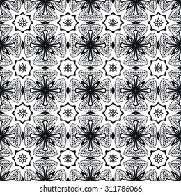 Black and white Vector seamless pattern, geometric and floral repeating texture. Tribal ethnic arabic indian ornament. Hand drawn doodle abstract background