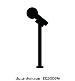 A black and white vector silhouette of a microphone