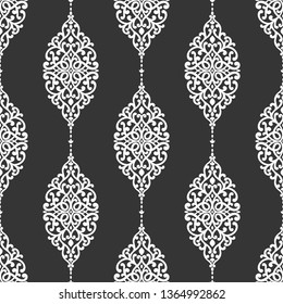 Black and white vintage seamless pattern with ornamental stripes. Traditional oriental motifs. Ornament template. Decorative paisley elements. Great for fabric and textile.
