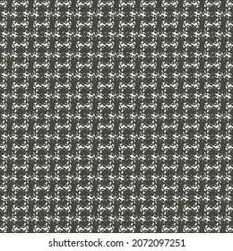 Tela de lana negra y blanca con un patrón de chevron. Patrón textil retro. Textura del tambor.