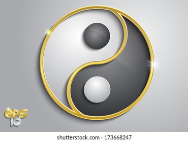 Black and white yin yang sign with gold on a gray background