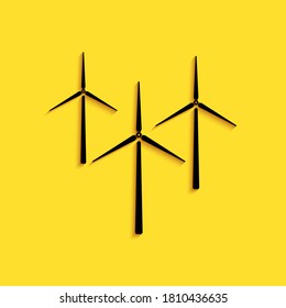 Black Wind turbine icon isolated on yellow background. Wind generator sign. Windmill silhouette. Windmills for electric power production. Long shadow style. Vector.