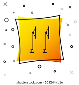 Black Windscreen wiper icon isolated on white background. Yellow square button. Vector Illustration