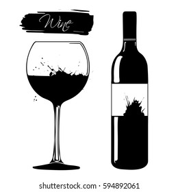 Black wine bottle with glass on white background.