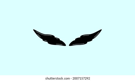 Black wings against a clear sky