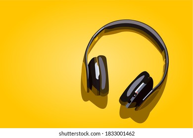 Black wireless headphone with yellow background