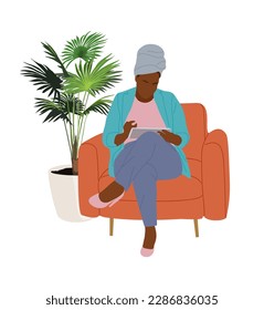 Black Woman with digital tablet in armchair vector