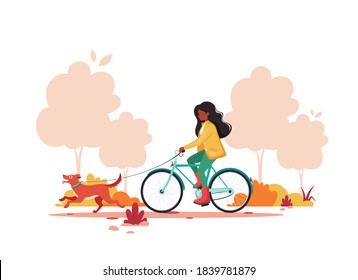 Black woman riding bike with dog in autumn park. Healthy lifestyle,  outdoor activity concept. Vector illustration.