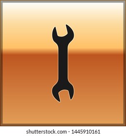 Black Wrench icon isolated on gold background. Spanner repair tool. Service tool symbol.  Vector Illustration