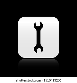 Black Wrench icon isolated on black background. Spanner repair tool. Service tool symbol. Silver square button. Vector Illustration