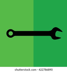 Black wrench tool icon vector illustration. Green background