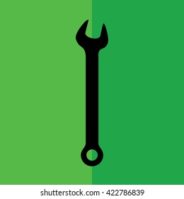 Black wrench tool vector icon illustration. Green background