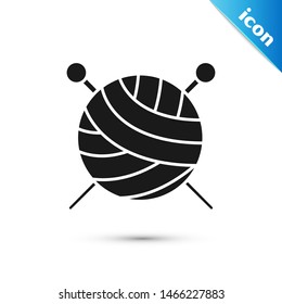 Black Yarn ball with knitting needles icon isolated on white background. Label for hand made, knitting or tailor shop.  Vector Illustration