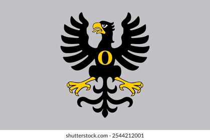 A black and yellow bird with an eye in the middle of its chest. The bird is sitting on a gray background