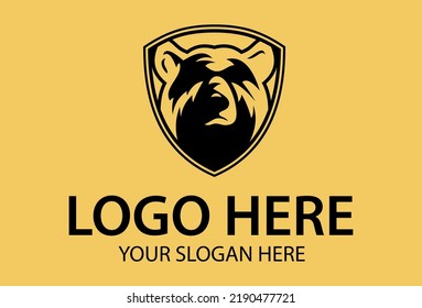 Diseño del logotipo del Escudo del oso de color negro y amarillo