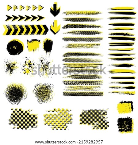 Black and yellow grunge design elements with tire tracks isolated on white background. Speed race track art objects for your wallpapers and banners