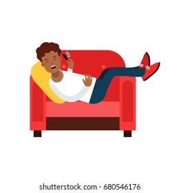 Black young man lying on a red armchair and talking on cellphone vector Illustration