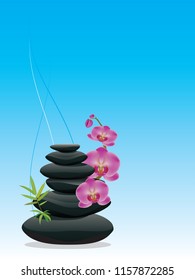 Black zen stones in a pile with orchid flowers.