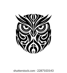 ﻿A black-and-white owl tattoo featuring Polynesian designs.