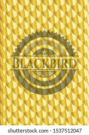 Blackbird gold emblem. Scales pattern. Vector Illustration. Detailed.