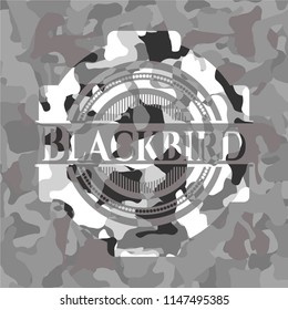 Blackbird on grey camo pattern