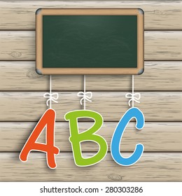 Blackboard with ABC on the wooden background. Eps 10 vector file.