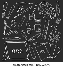 Blackboard chalk doodles with many school stationery hand drawn objects. White outline sketches on black background. Pen, pencil, ruler, compasses, eraser, etc. For Back to School design projects.