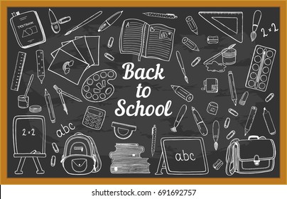 Blackboard chalk doodles with many school stationery hand drawn objects. White outline sketches on black background. Pen, pencil, ruler, compasses, eraser, etc. For Back to School design projects.