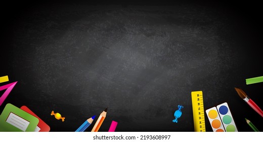 Blackboard with colorful school equipment and copy space