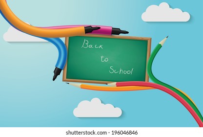 Blackboard with pencils and markers