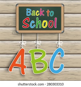 Blackboard with text "Back to School". Eps 10 vector file.