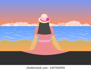 Black-haired girl on the beach in a pink dress looks at the sunset and the sea.