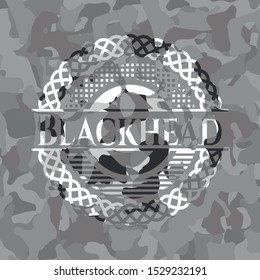 Blackhead on grey camouflage texture