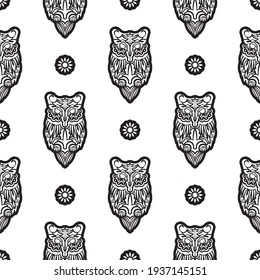 Black-white Seamless pattern of owls in boho style. Good for backgrounds, prints, apparel and textiles. Vector 