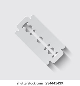 Blade razor with shadow on a grey background