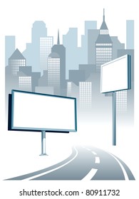 Blank billboard at the road, cityscape in the background.