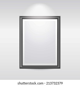 A Blank Black picture frame on a wall in a gallery